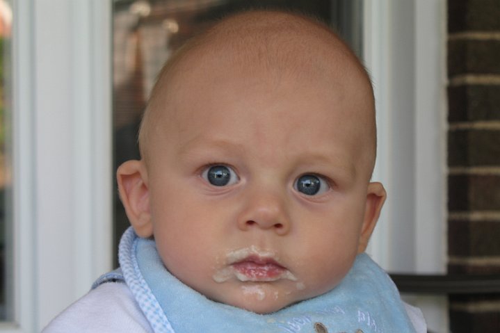 first solid food.JPG - Some of it really did get in his mouth.